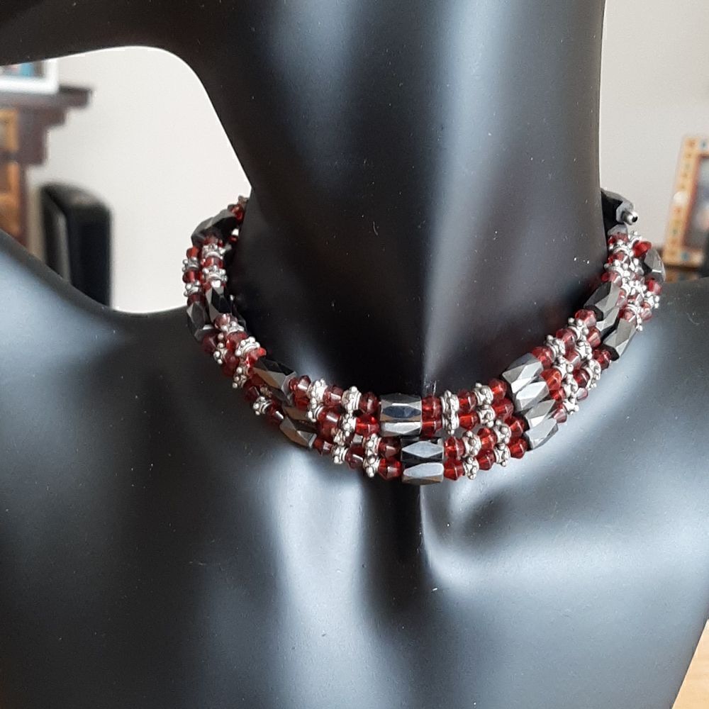 Two ruby and black colored magnetic necklaces/bracelets